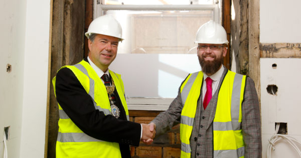 General Manager Craig Miller and the Lord Provost shake hands the original doorways