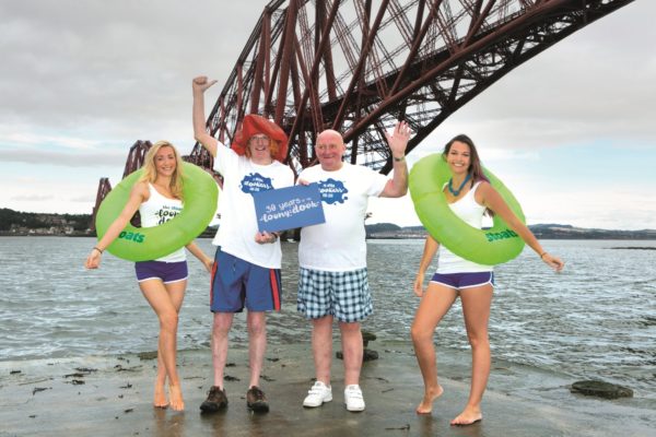 Iain Armstrong and Jim Mackenzie, two of the longest serving Dookers, celebrate the 30th Anniversary of the South Queensferry Loony Dook with new sponsors Stoats.  The South Queensferry Loony Dook, part of the Edinburgh’s Hogmanay Festival, will take place on 1st January 2016 and registration is now open.