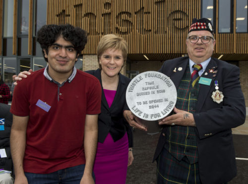 First Minister Nicola Sturgeon joins people supported by a Scottish charity working to transform health and social care delivery in Scotland, as she buries a time capsule of symbolic items to celebrate the opening of its new purpose-built Centre of Wellbeing.  Pic shows: Rameez Haq and Robert Conquer both of whom have been supported by the Thistle Foundation with the First Minister.