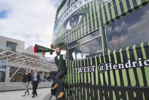 Hendricks Gin Bus arrives in Edinburgh. A delightfully unusual Hendrick’s Gin bus called H.E.R.B.E.R.T. has arrived in Edinburgh today, and will be taking passengers on a whimsical tour of the city between 8th and 14th August.   Max (beard) and Nick will be welcoming guests and entertaining them as they tour the city. 8th August 2016