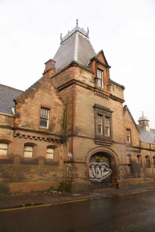 Central part of red sandstone facade at Powderhall Stables