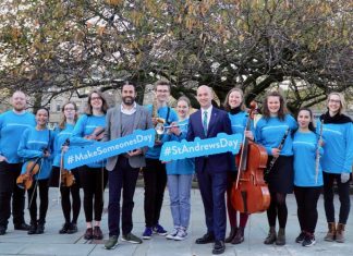 Minister Ben Macpherson with musicians at St Andrew Square