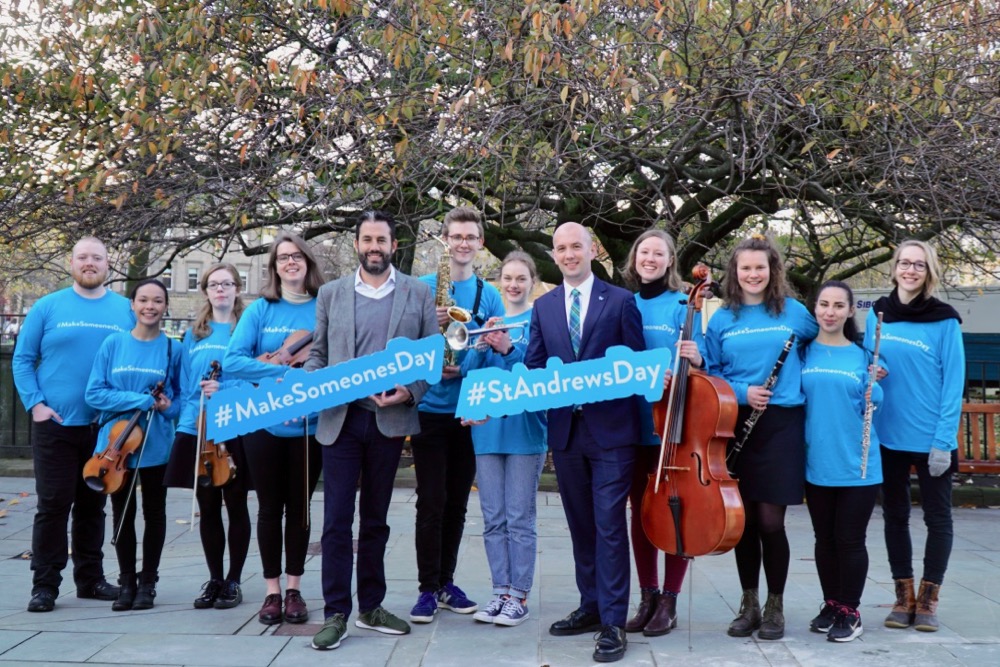 Minister Ben Macpherson with musicians at St Andrew Square