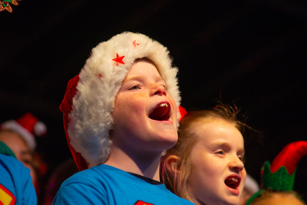 Singer wearing Xmas hat