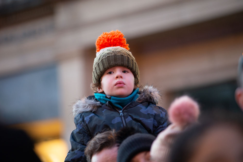 Young child in the crowd