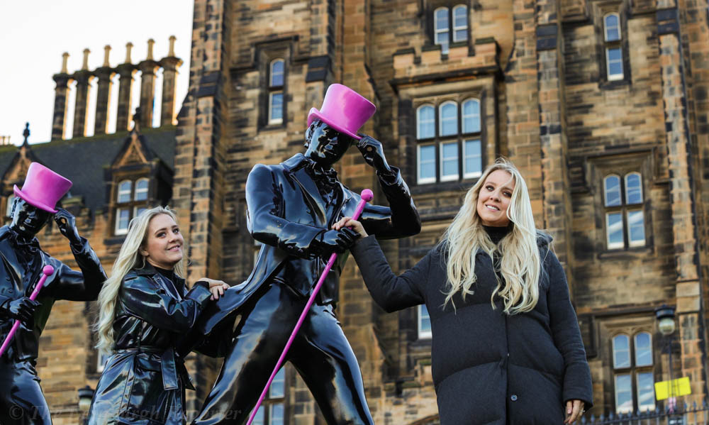 Blond twins with striding statues