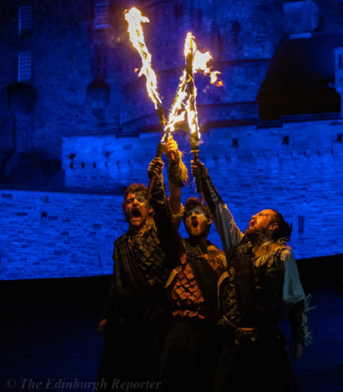 Three men with fiery swords in front of blue castle