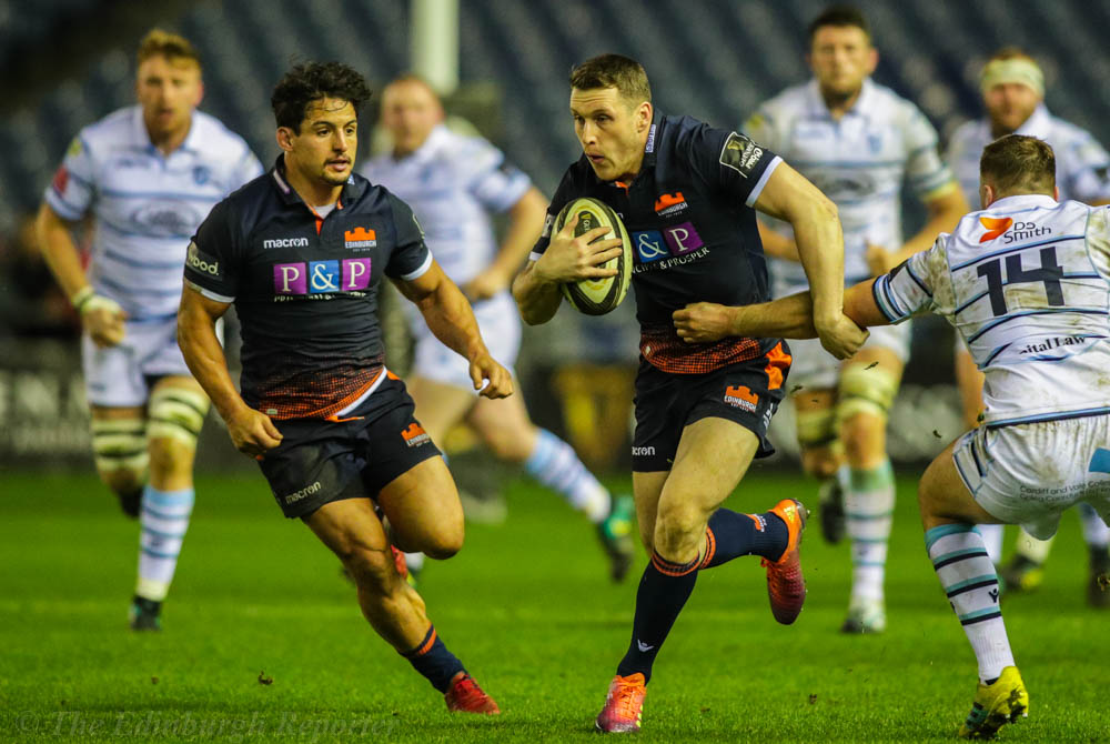 Edinburgh player avoiding a tackle