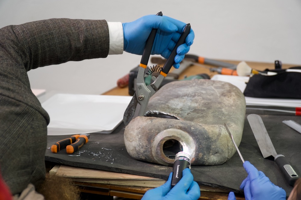 Time capsule found below the Robert Burns statue in Edinburgh being opened with handtools on 24 January 2020