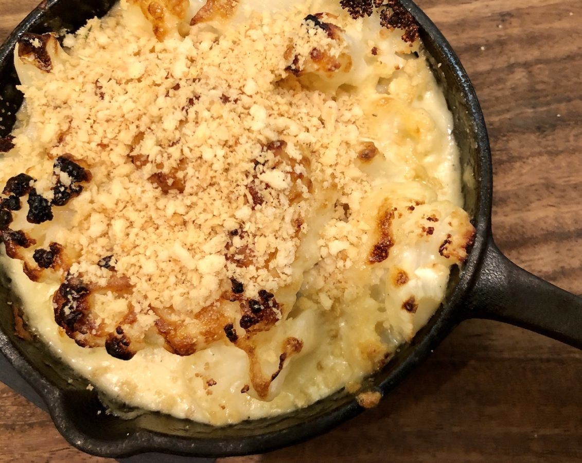 cauliflower cheese served in a skillet