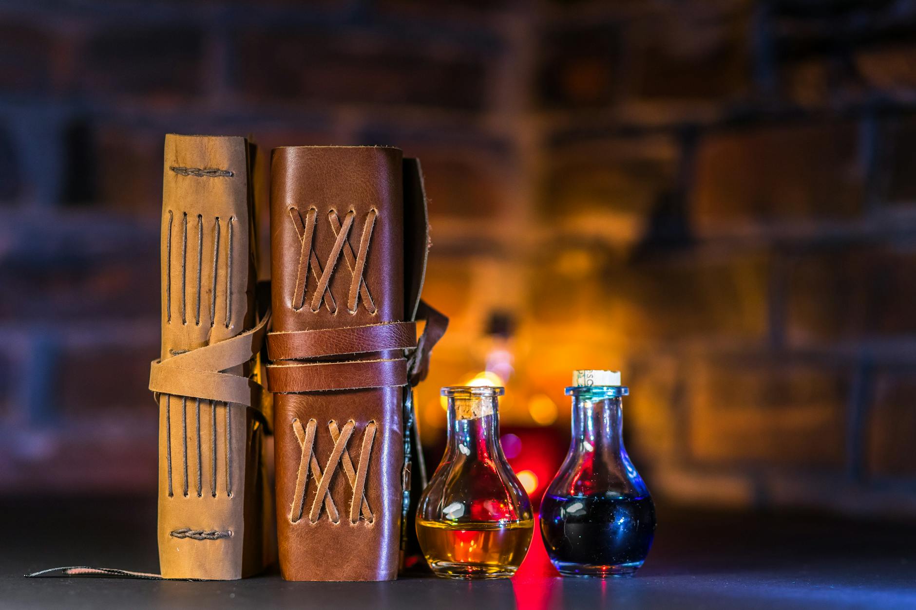 close up shot of spell books beside potions