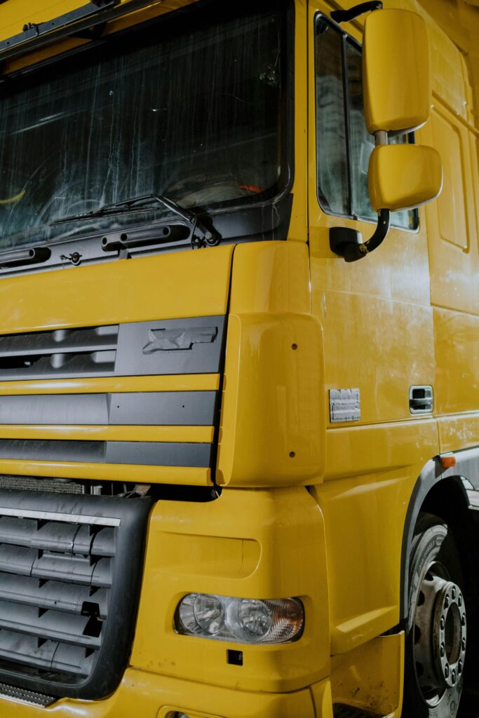 Photo by cottonbro studio: https://www.pexels.com/photo/a-yellow-daf-xf-truck-close-up-photo-7541348/